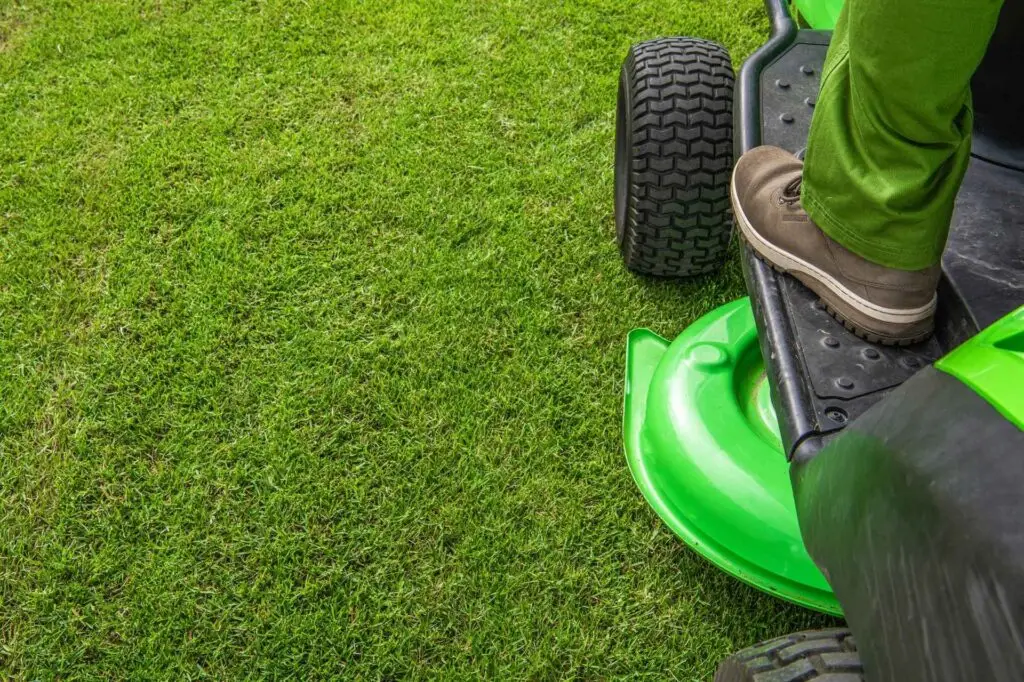 Lawn mower in operation by Asher's Lawn Care